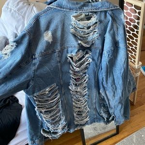 Worn once extremely distressed denim jacket